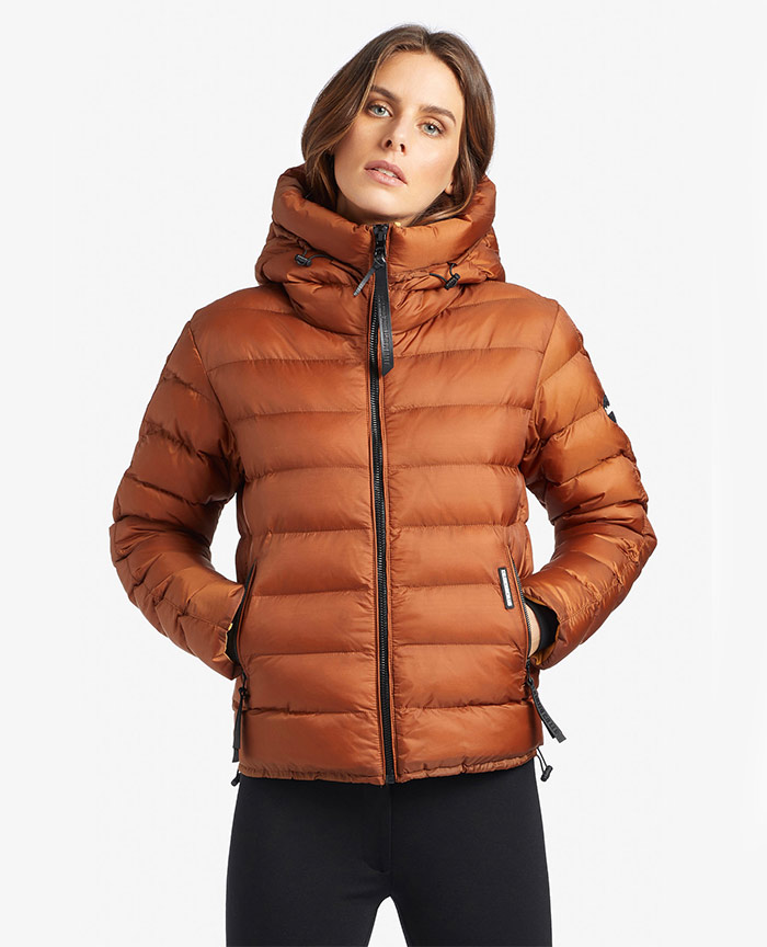 woman wearing thick orange quilted jacket