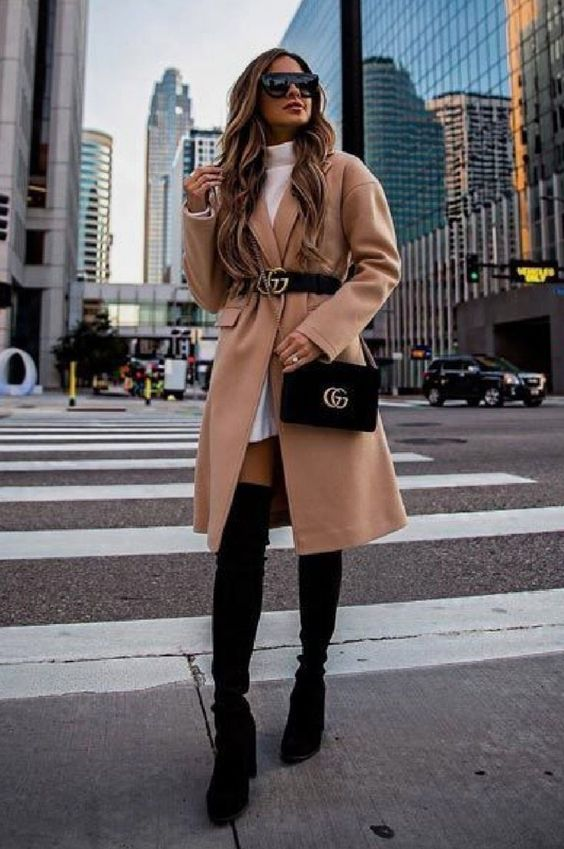 woman wearing beige coat and black boots