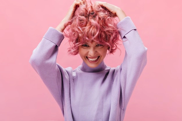 pink-haired girl rocking her lavender sweater